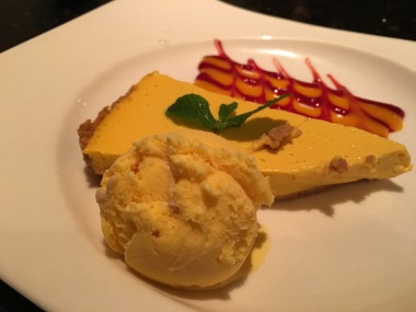Mango mouse/flan/cheesecake with mango ice cream and raspberry sauce